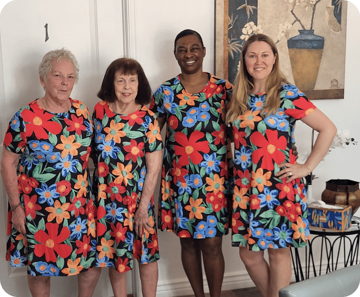 Friends in coordinating flower-patterned outfits