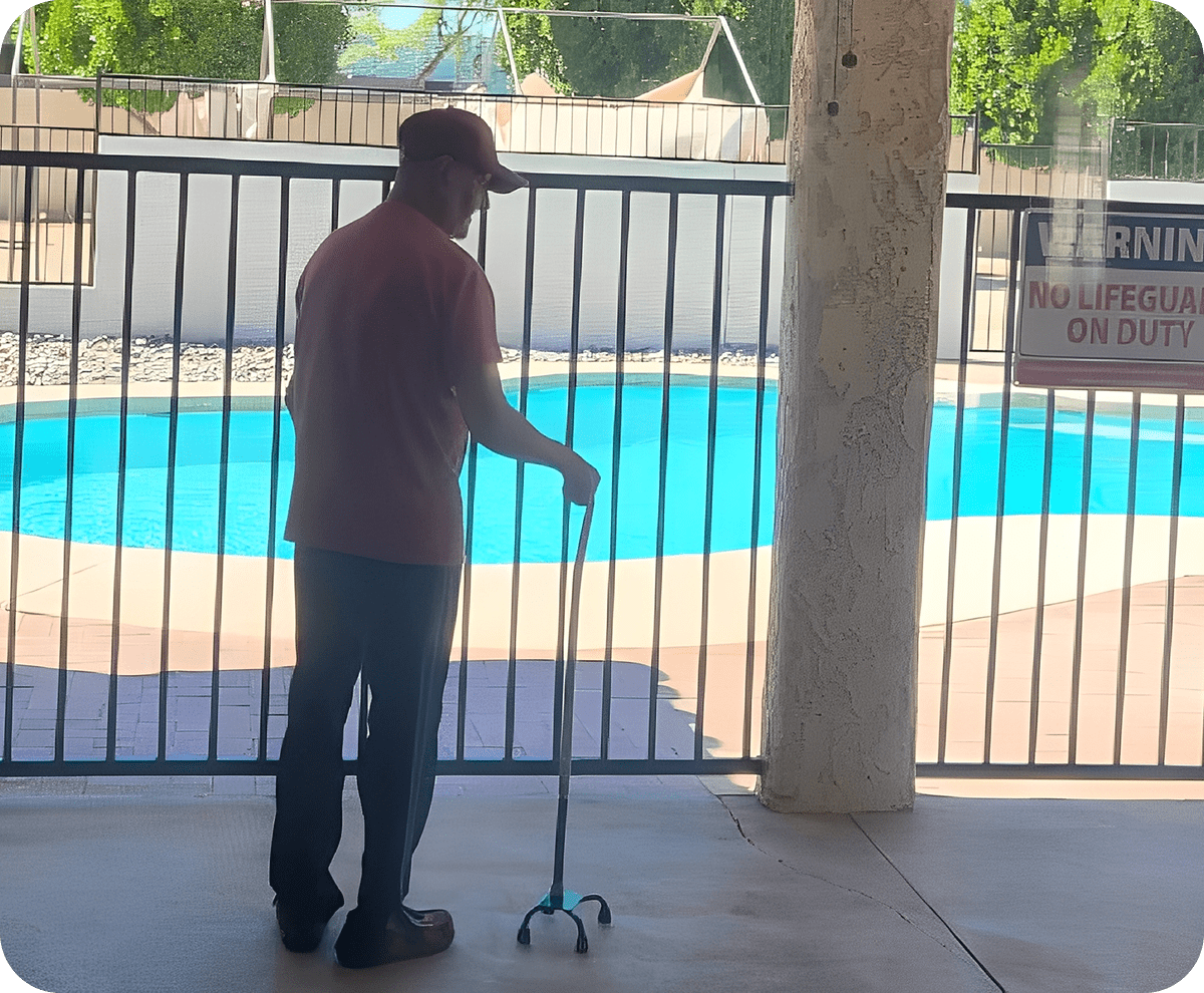 Individual observing pool through metal fence